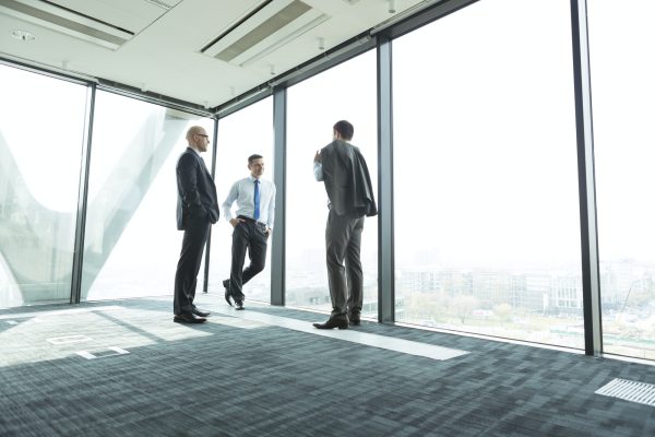 Three businessmen in office